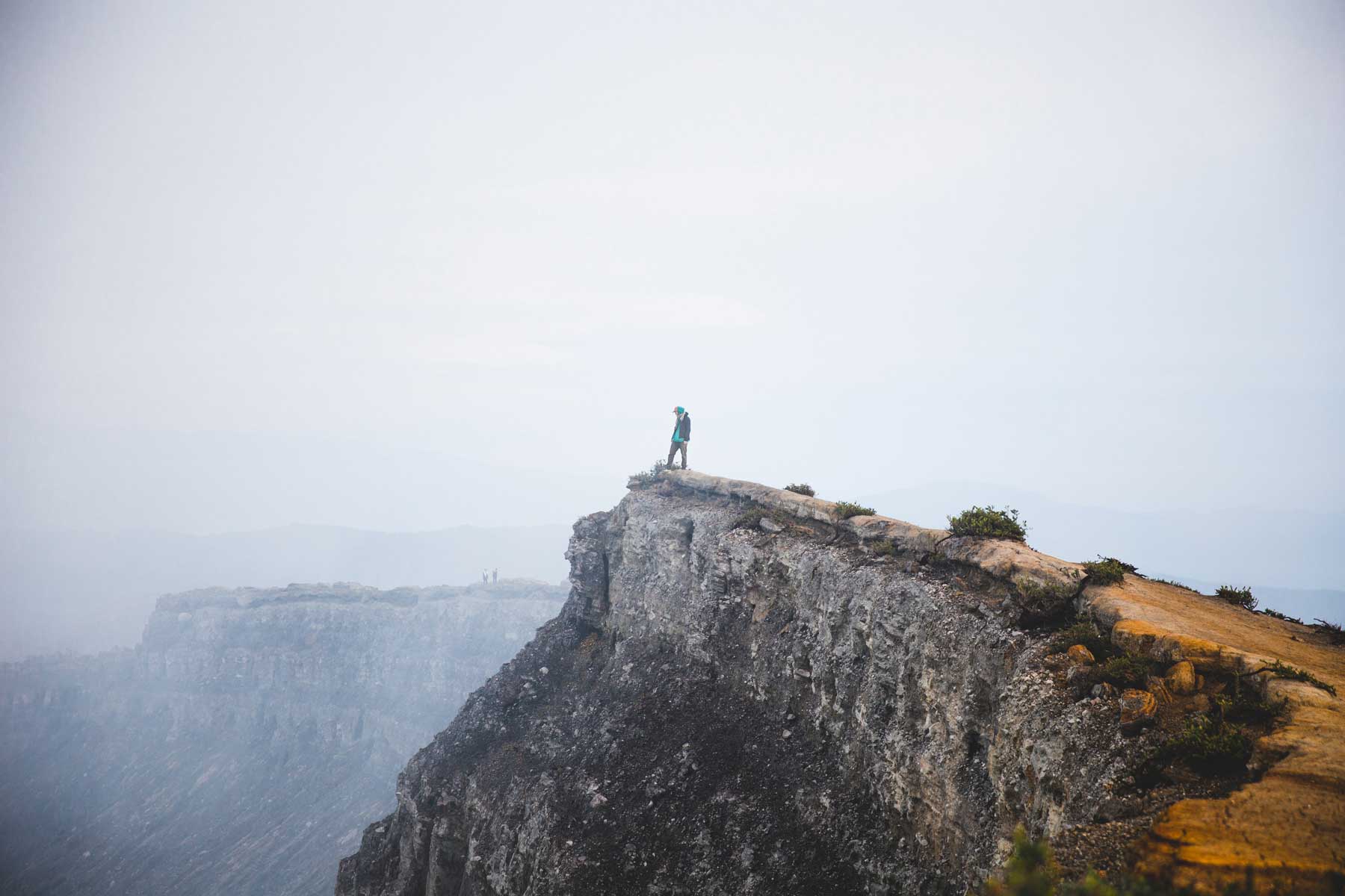 Adventurer on a steep cliff